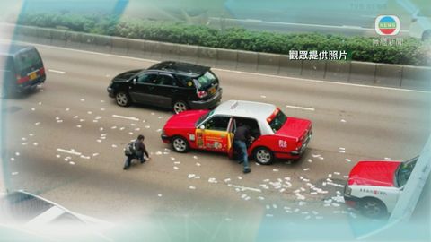 大批鈔票散落灣仔告士打道行車線