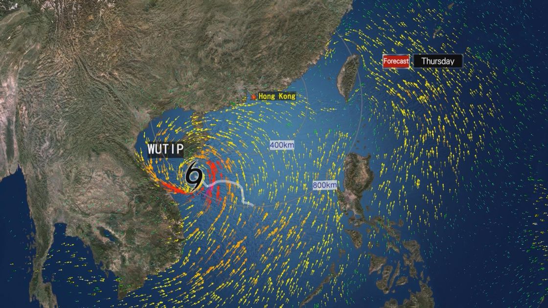 A weather map shows a tropical cyclone near Hong Kong with strong wind patterns, squally showers, thunderstorms, and northeast monsoon conditions, indicating an emergency preparedness alert with a Standby Signal No. 1.