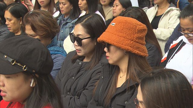 Foreign domestic workers mourn those died in fire Foreign domestic workers mourn those died in fire