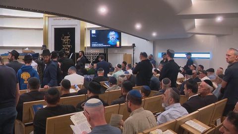 Suspect charged as first Bondi shooting victim's funeral takes place