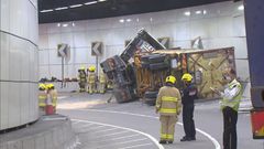 Truck overturns in Tseung Kwan O-Lam Tin Tunnel