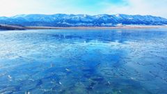 Sayram Lake in Xinjiang,  begins to freeze, shimmering with drifting ice
