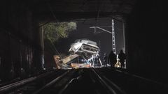Barcelona commuter train crashes after retaining wall falls on track
