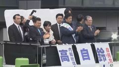 Japanese voters brave torrid winter weather to vote in general election