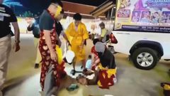 Thai police disguised in lion dance costume arrest elusive burglar