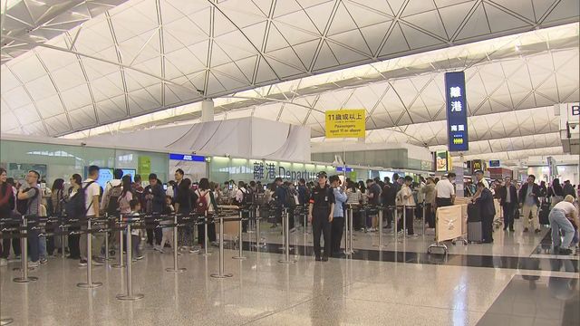 HK airport busy with holidaymakers as long weekend begins