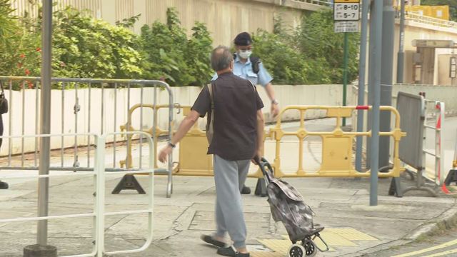 Residents of Wang Fuk fire damaged buildings return to collect belongings
