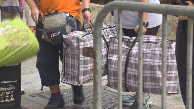 Wang Fuk families search for memories among ashes